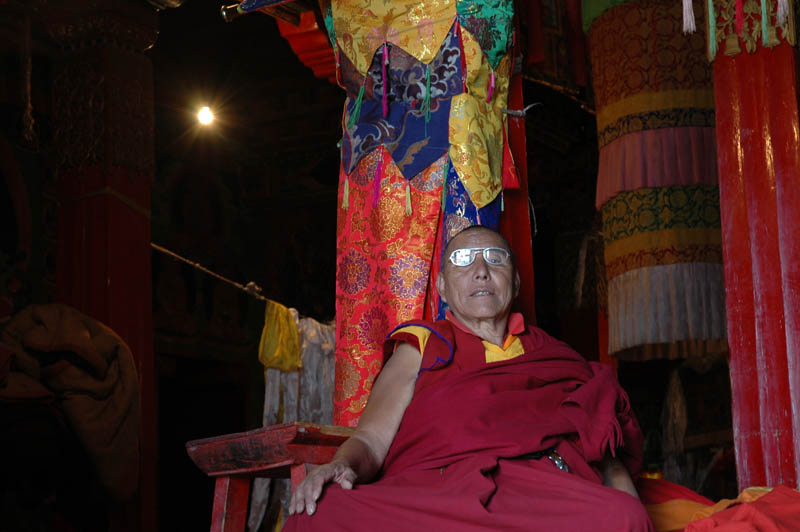 Lama proudly posing in the reading glasses I left with him